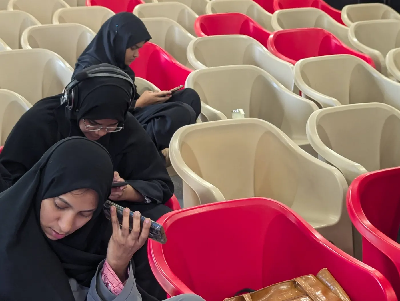 Karya workers sharing a phone during a session