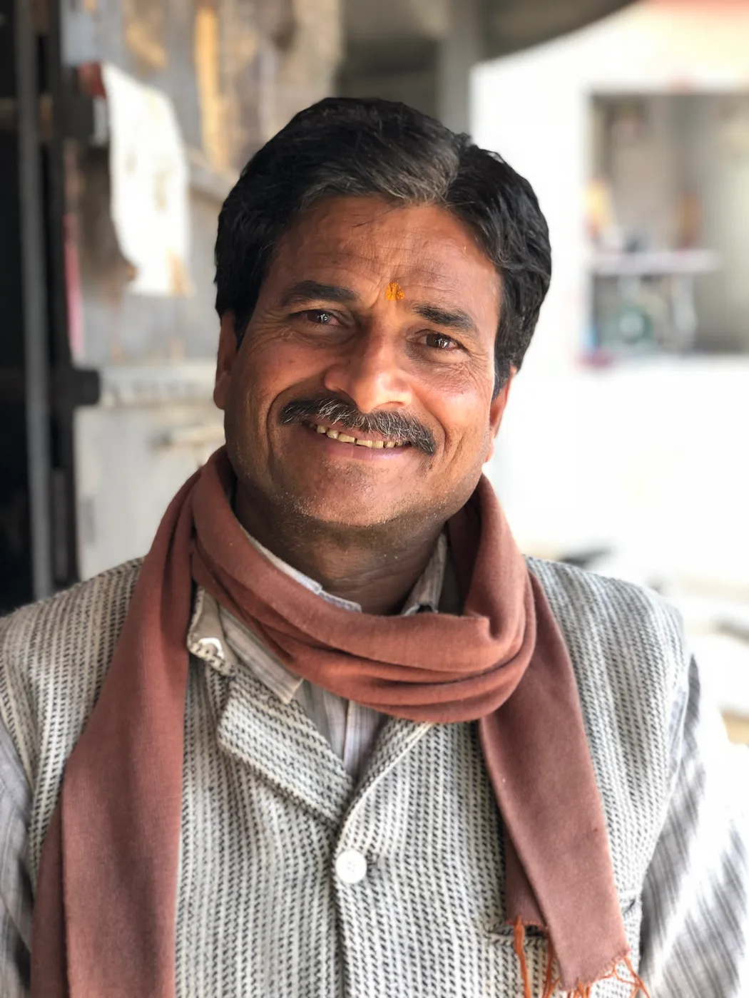 A Karya worker smiling to camera